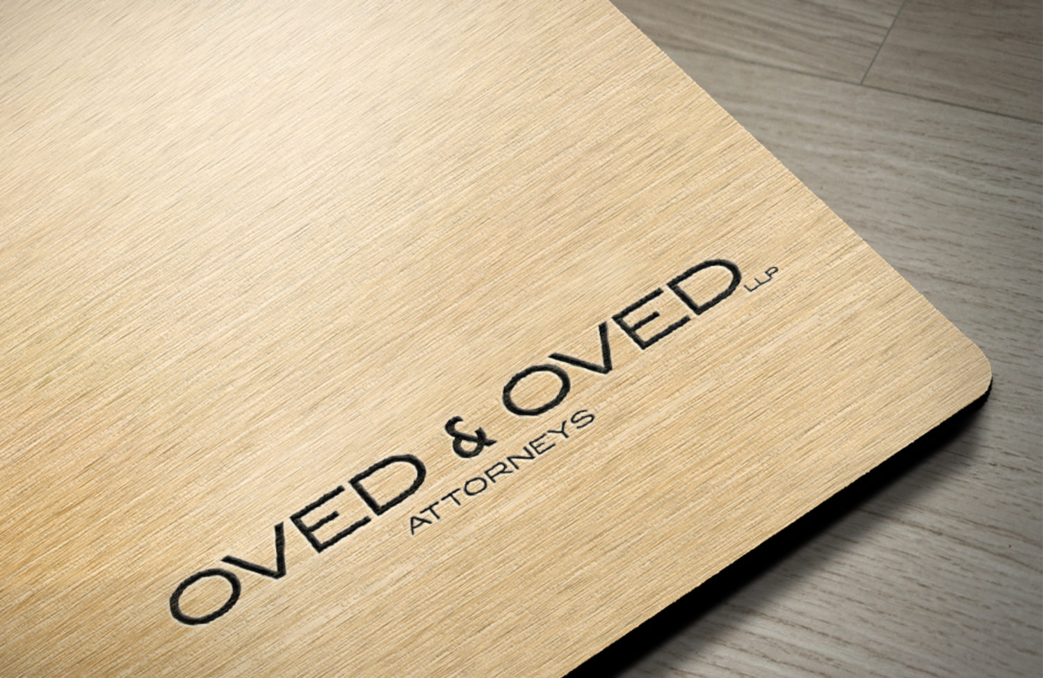 law firm logo design displayed on wood surface