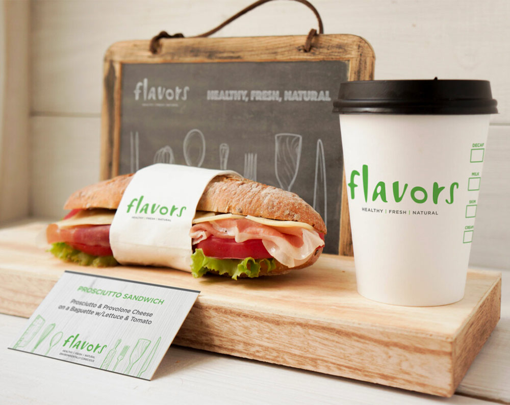 restaurant branding design displayed on food wrapper, paper cup and business card