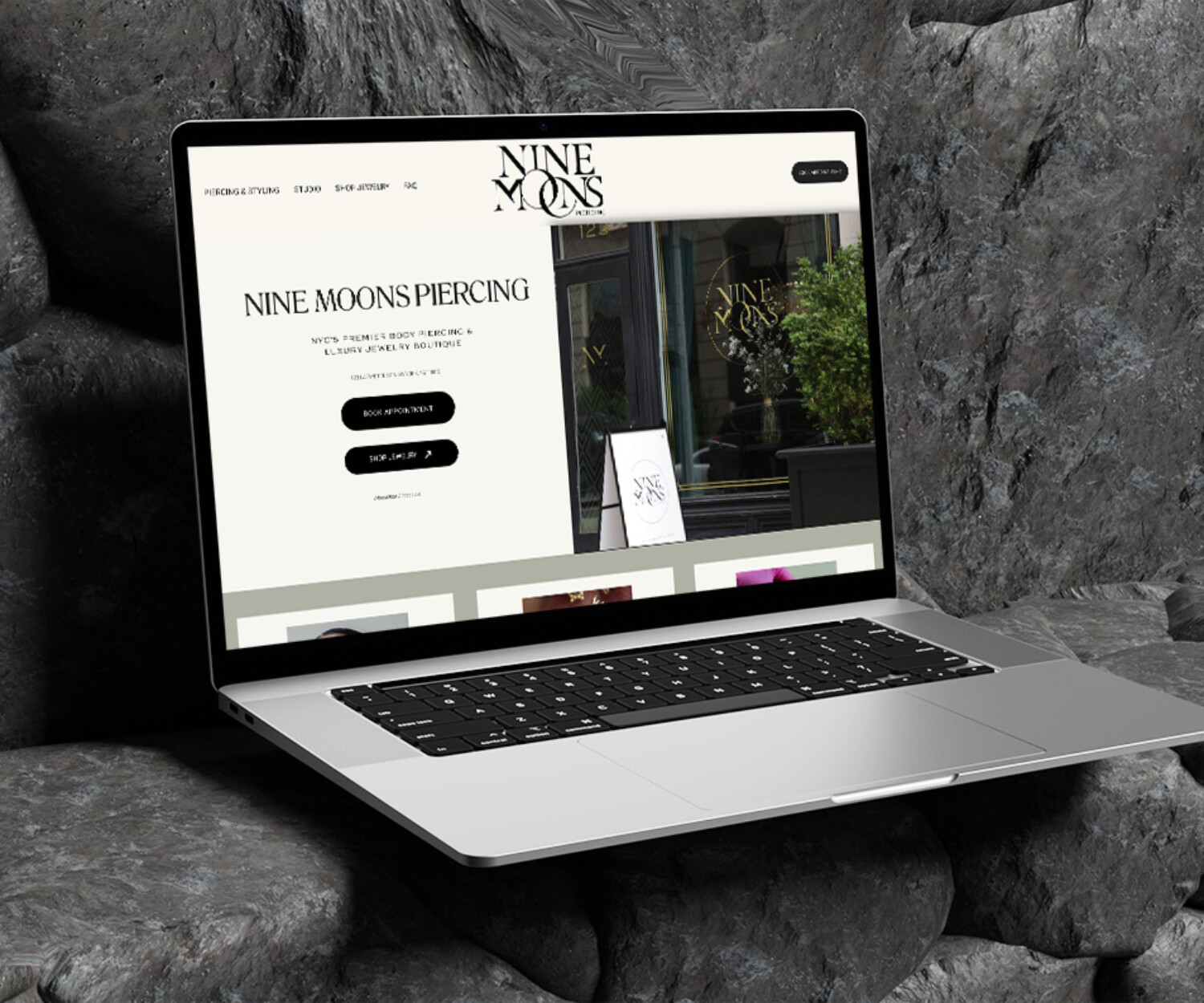 Web design for piercing shop displayed on lap top screen