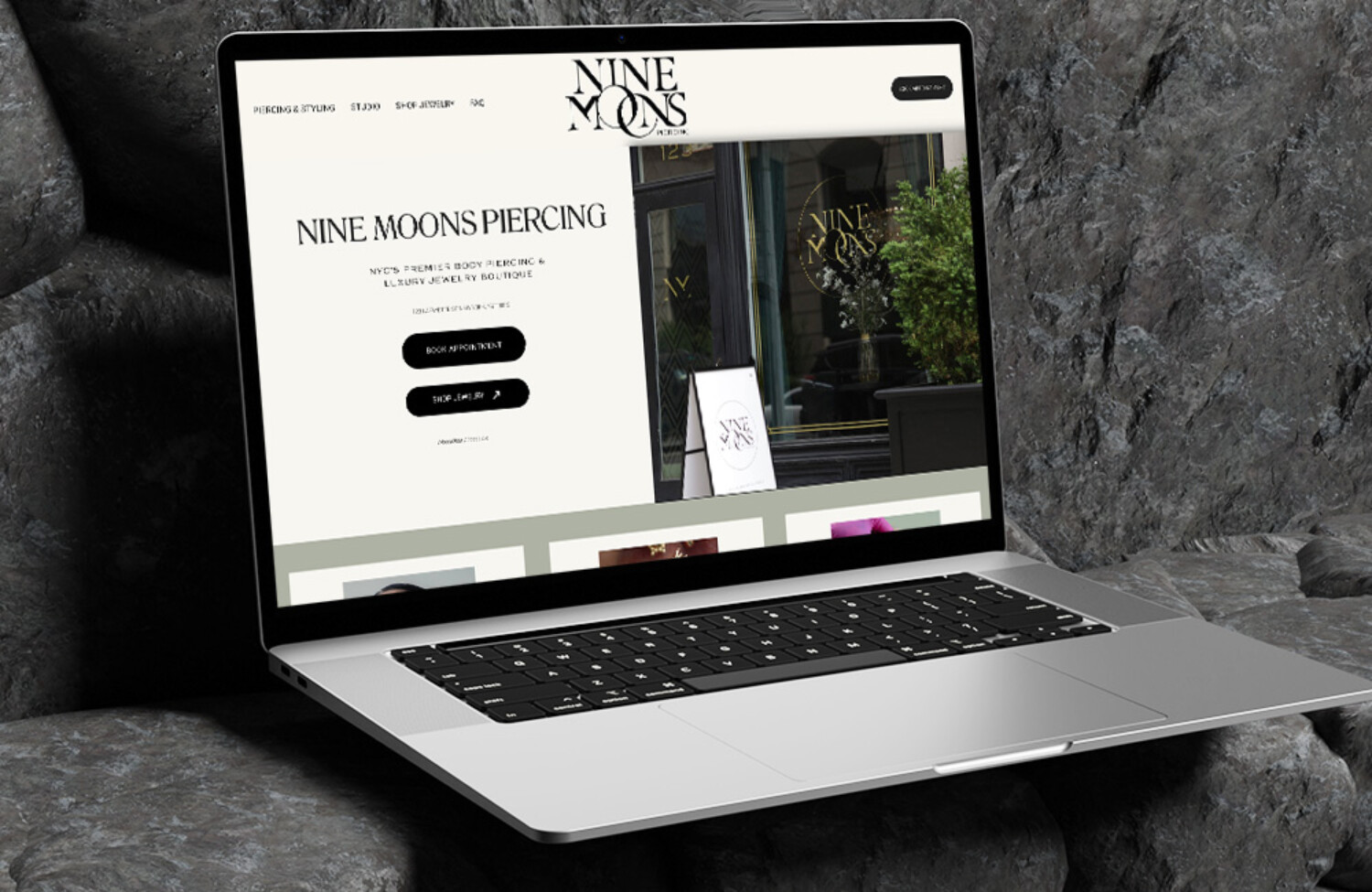 Web design for piercing shop displayed on lap top screen