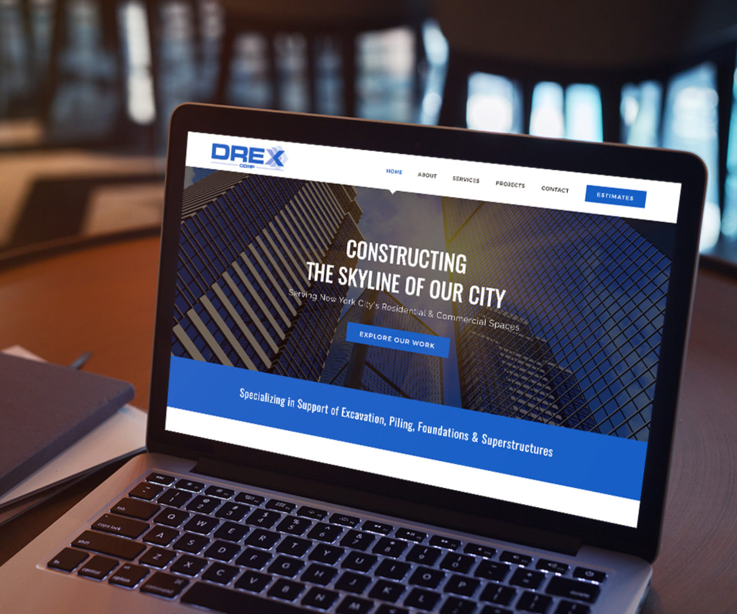 construction web design displayed on a lap top computer screen