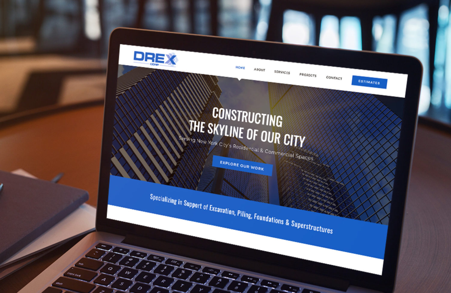 construction web design displayed on a lap top computer screen