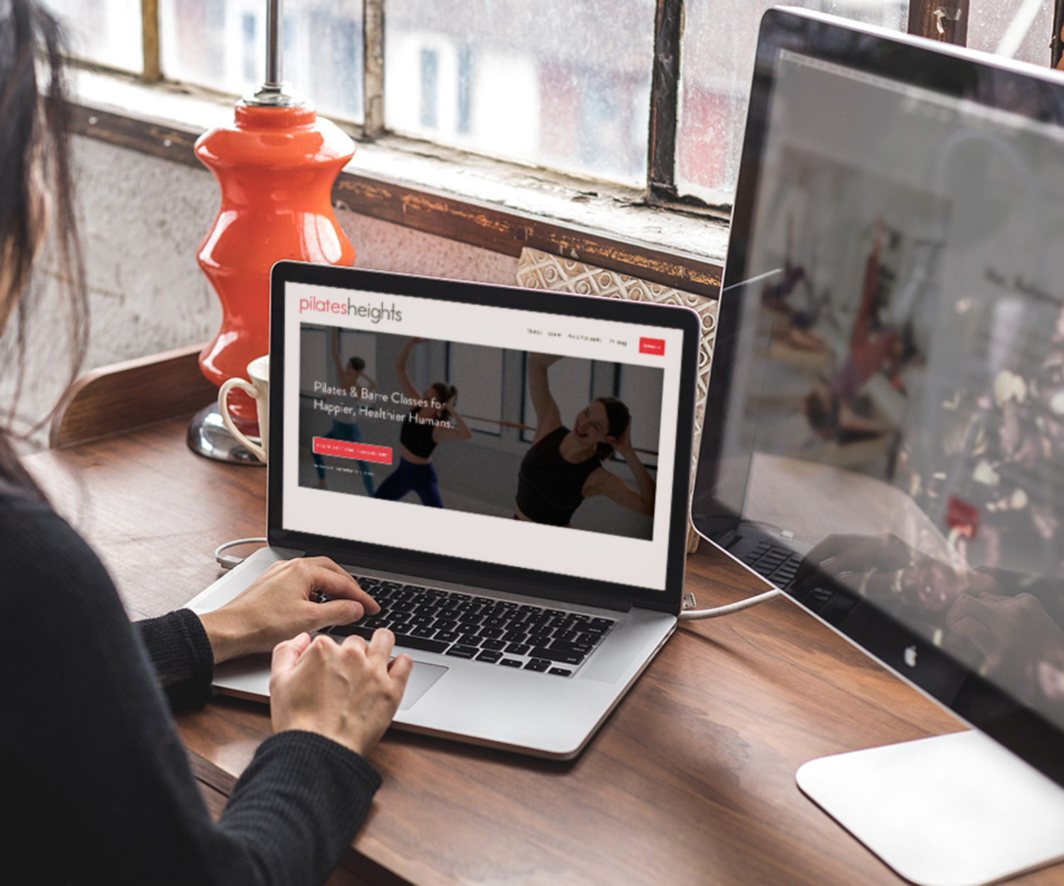 pilates studio web design displayed on a lap top computer screen