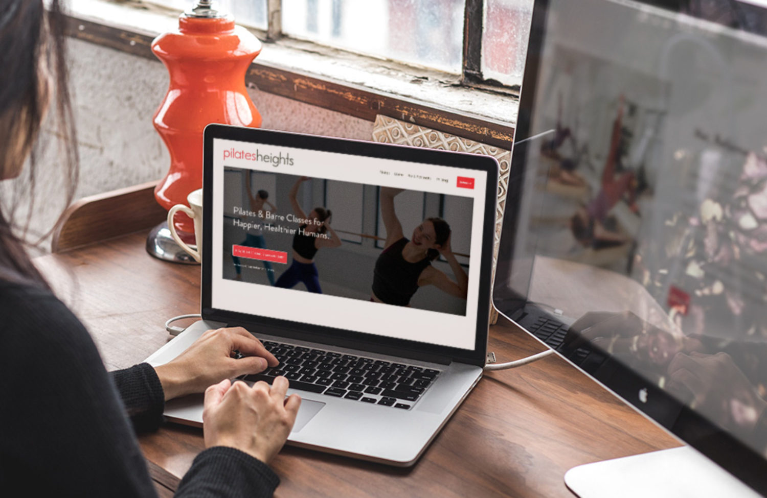 pilates studio web design displayed on a lap top computer screen