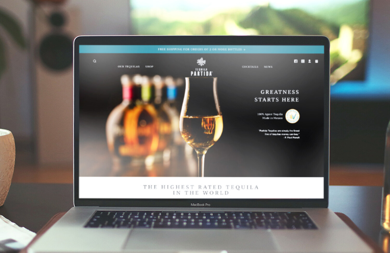 Web design for tequila brand displayed on lap top screen