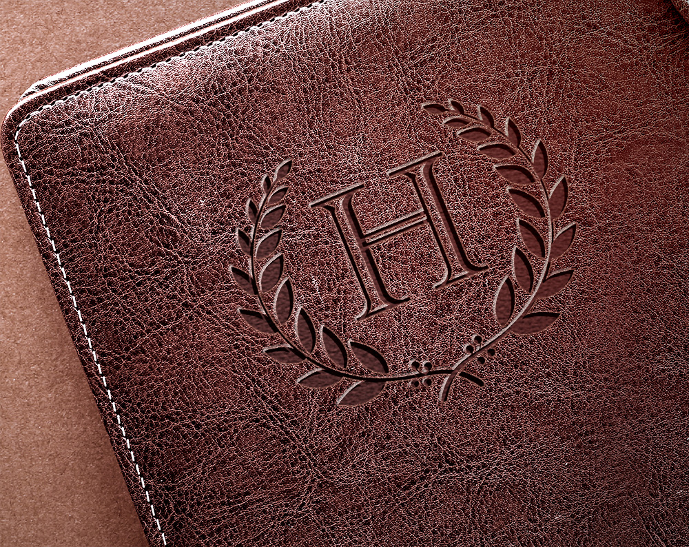 Logo design for wealth advisor displayed on leather