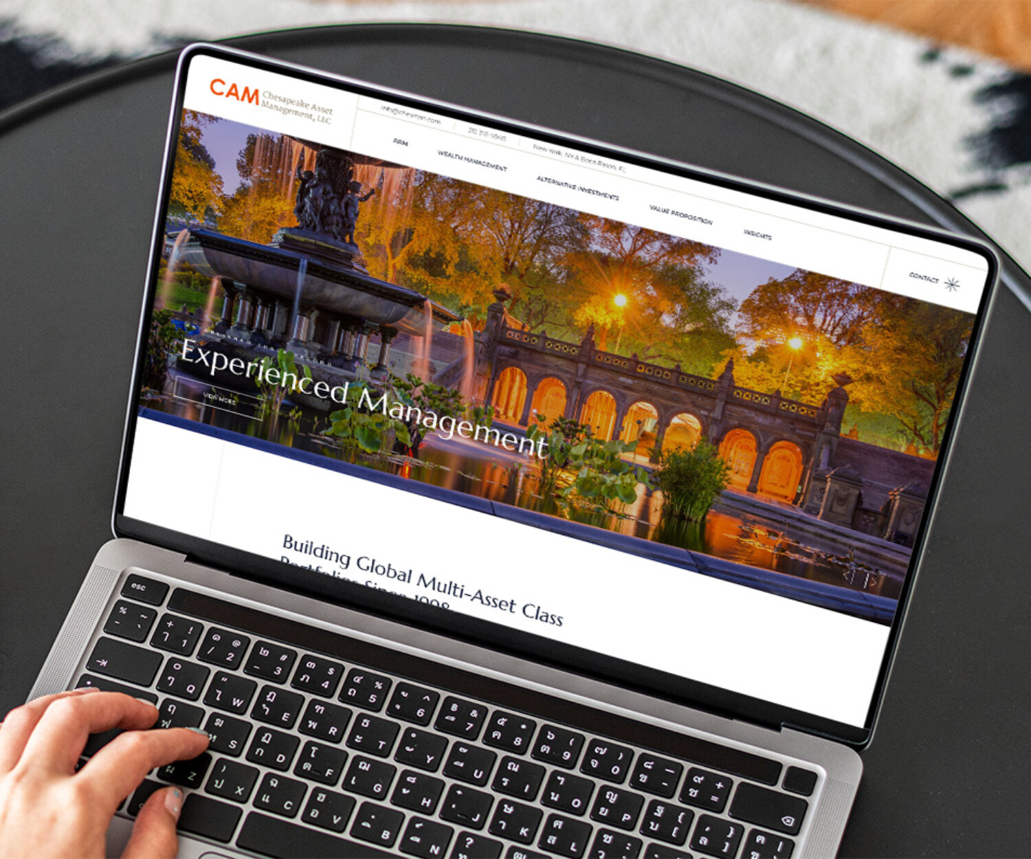 Web design for wealth management displayed on lap top screen