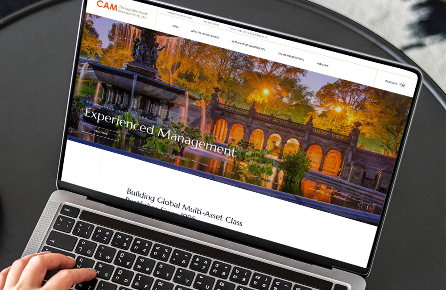 Web design for wealth management displayed on lap top screen