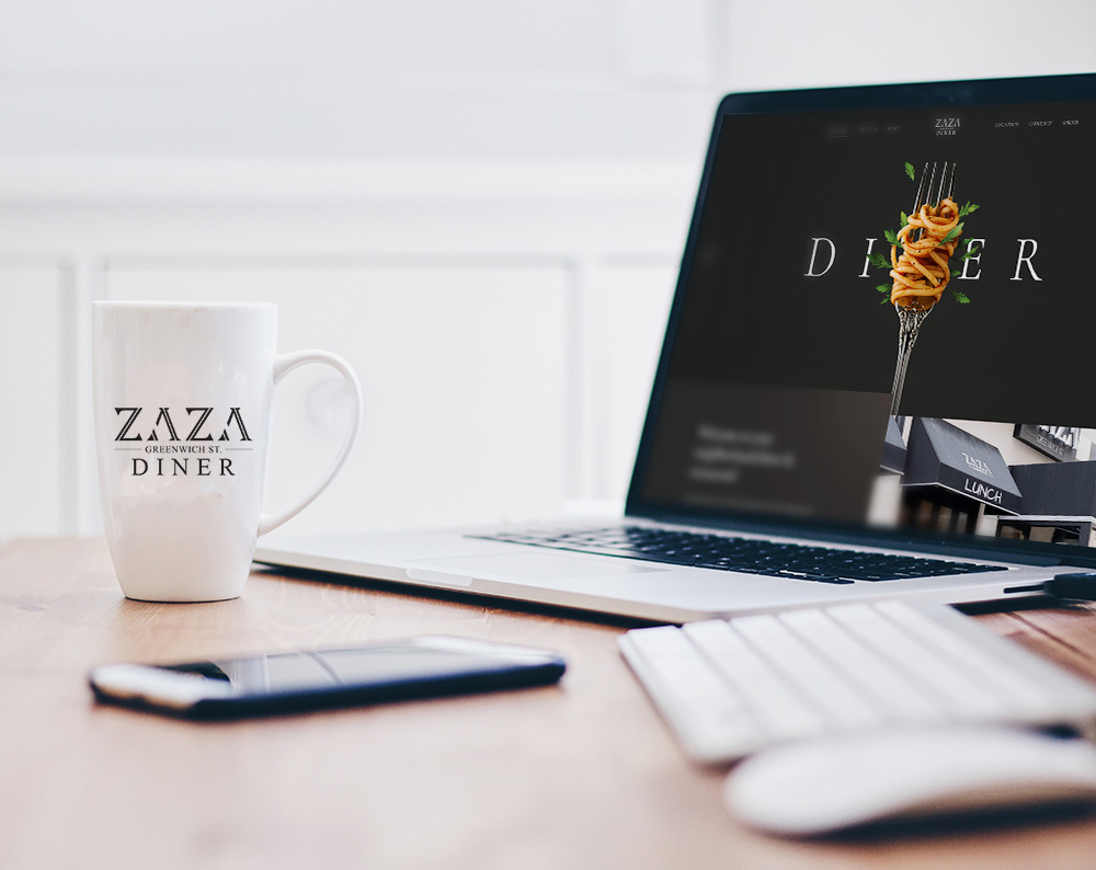 Website design for a diner displayed on a laptop